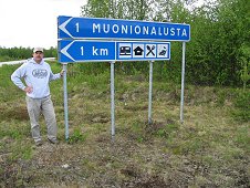 Muonionalusta Expedition - Greg Hupe and Muonionalusta sign.