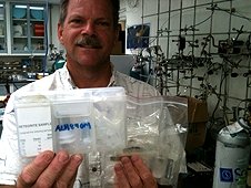 NASA - JSC Visit - Greg holding a bag containing ALH84001 Martian meteorite samples.