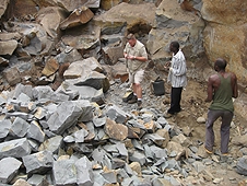 Thika, Kenya Expedition - Mike in rock quarry with some workers.